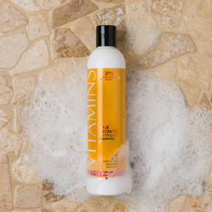 Vitamins Hair Growth Support Shampoo with Biotin, Coconut Oil, Castor Oil, and Procapil with bubbles around the bottle