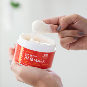 Woman using two fingertips to scoop a dollop of Premium Hair Growth Support Restorative Mask with Baicapil, Procapil, and Coconut oil