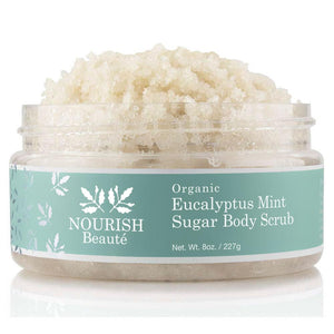 A mound of Organic Eucalyptus Mint Sugar Body Scrub peaking out of the container