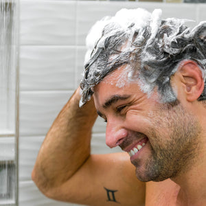 Man with full lather of Men's Hair Growth Strength and Support Shampoo