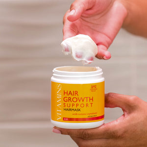 Woman using two fingertips to scoop a dollop of Vitamins Hair Growth Support Nourishing HairMask with Natural Ingredients