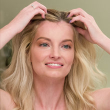 Load image into Gallery viewer, Woman applying Nourish Burst Hair Growth Accelerating Serum onto front head of blonde hair with her fingertips